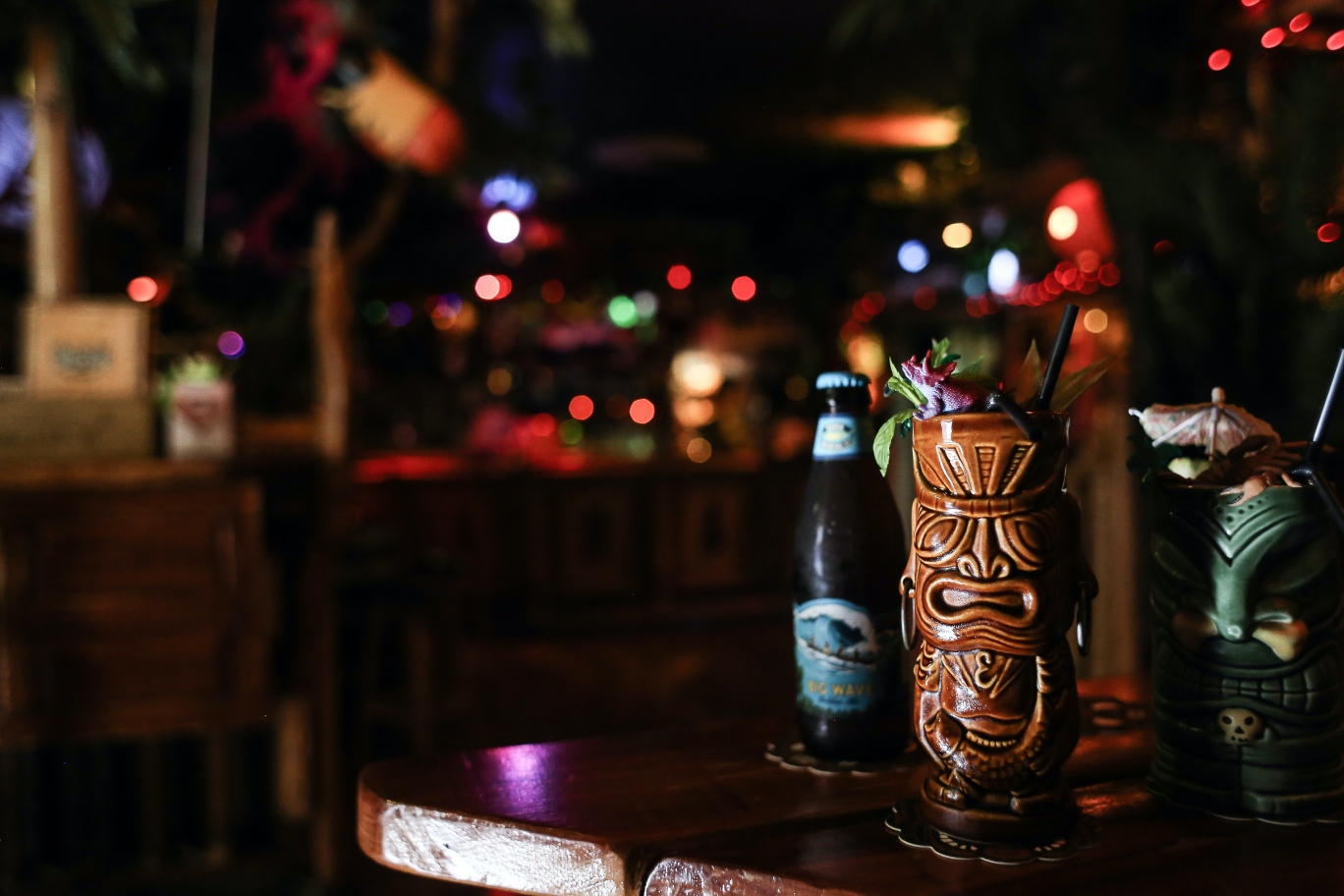 Tiki mug and beers in a tiki bar-themed man cave