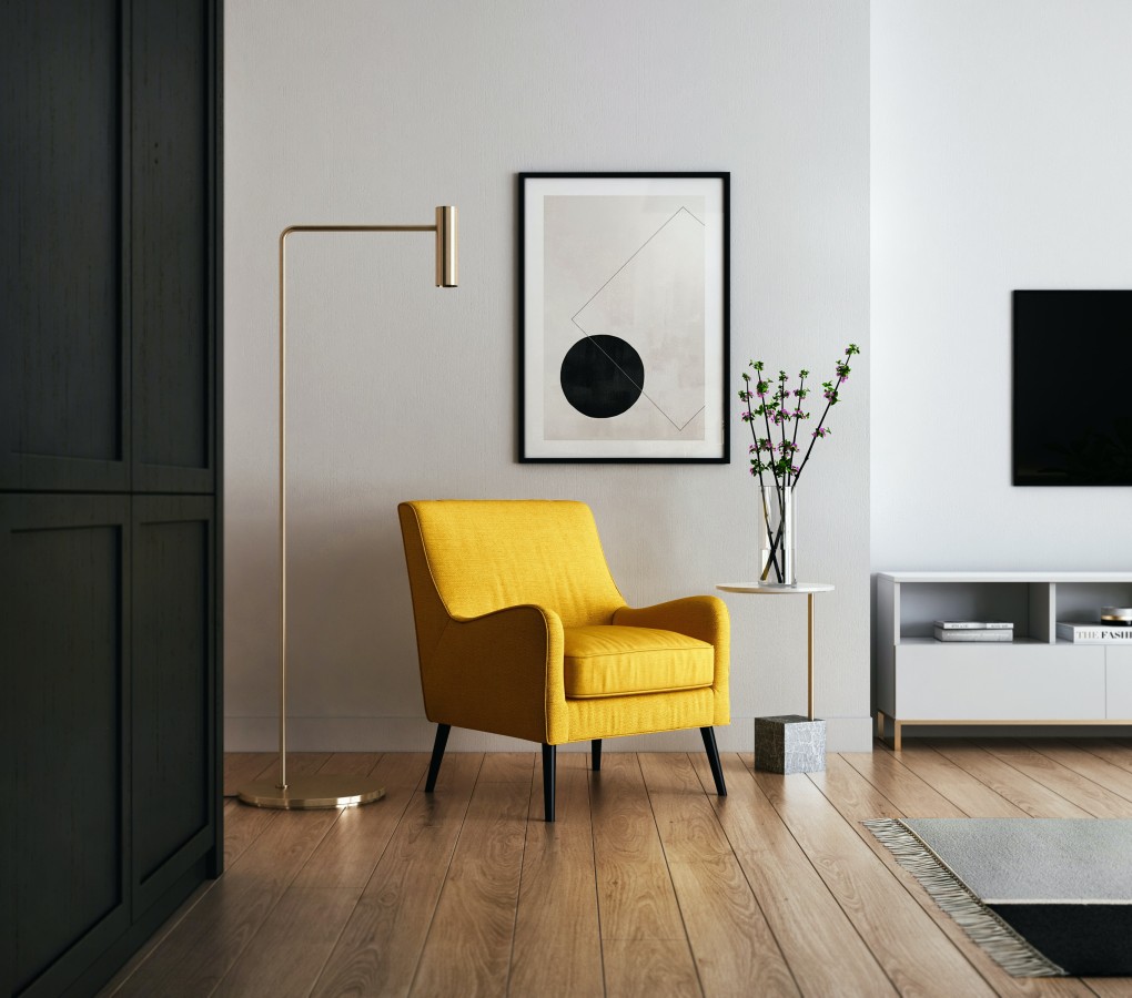 A minimalist living room with a yellow accent chair