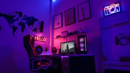 Computer gaming room lit up in purple lights