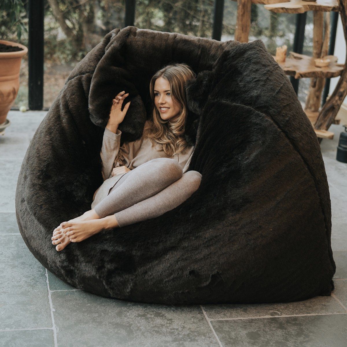 Faux fur slab bean bag with woman relaxing